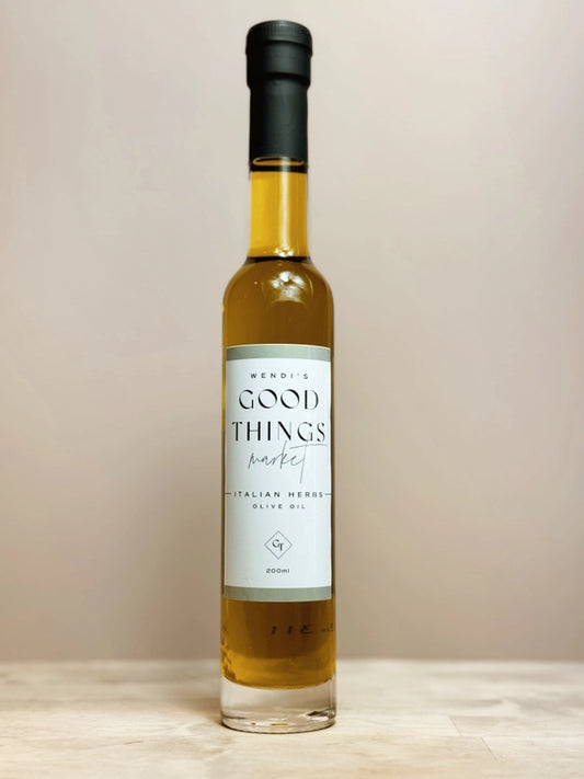 Bottle of Good Things Italian Herb olive oil on a neutral background